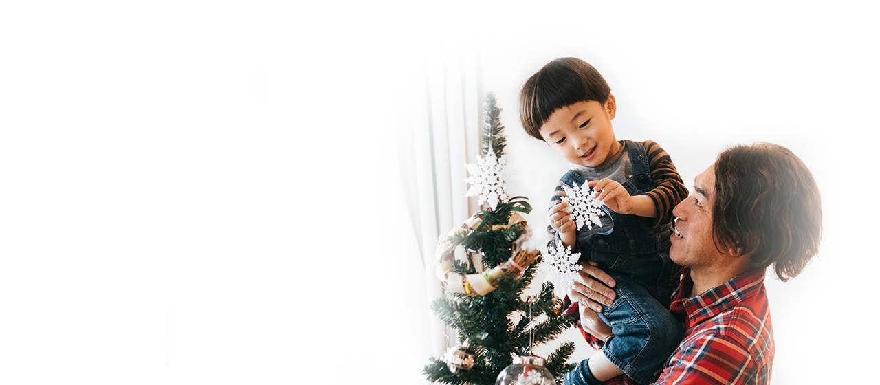 Man and toddler son by tree